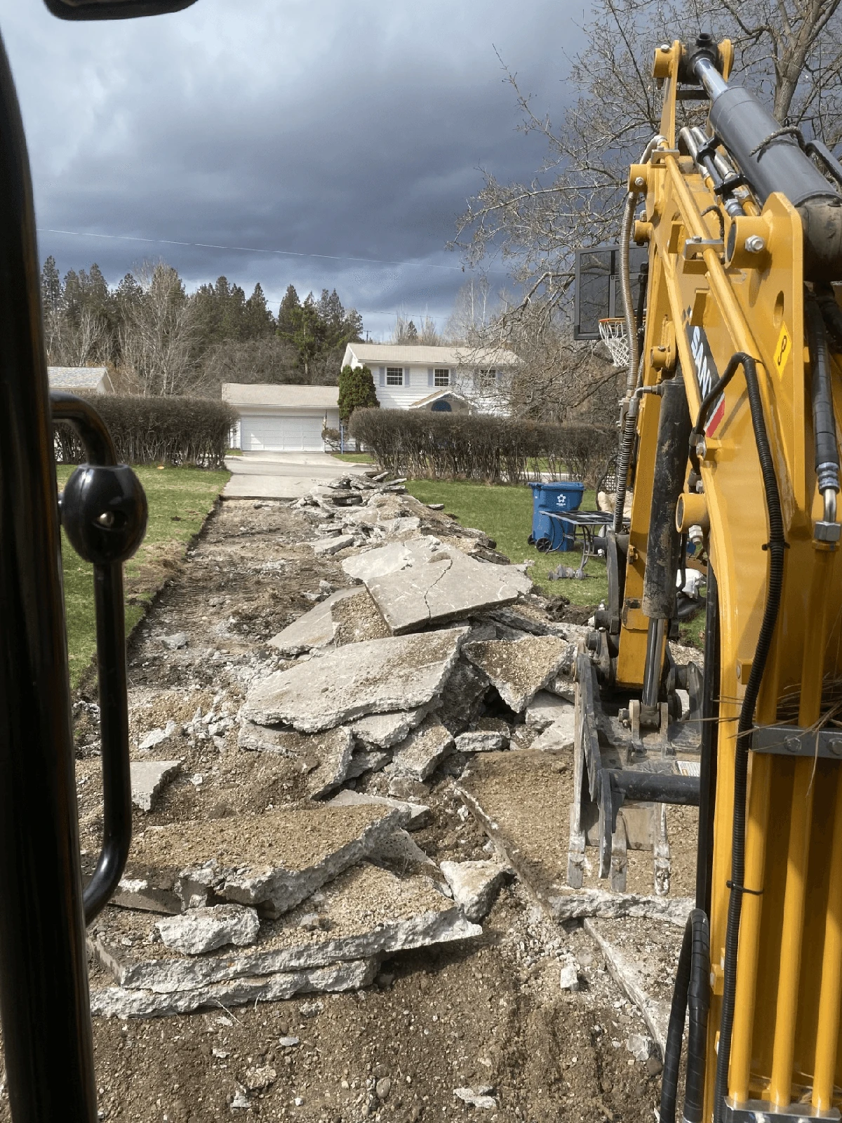 Excavator with broken concrete
