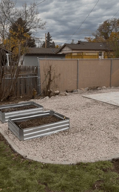 Curved gravel bed with raised planting boxes